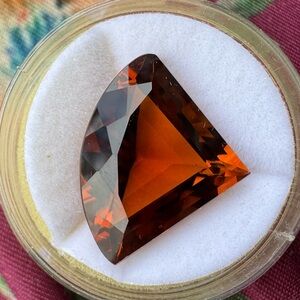 15.00carat custom cut mandarin citrine loose in jar